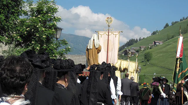 Traditional procession in Marebbe